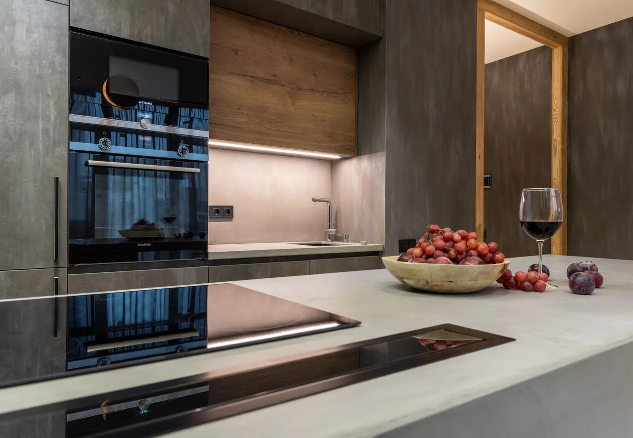 A kitchen in a rental apartment with fresh fruit and wine on the counter - styling before a photo shoot